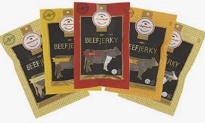 A set of four different books with animals on them.