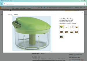 A green plastic container sitting on top of an electronic device.