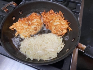 A pan with some food in it on top of the stove.